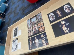 exhibition case containing artwork prints